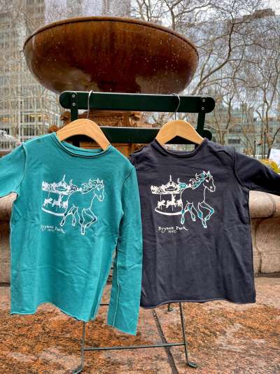 Kids long-sleeved t-shirts by Teres Kids for Bryant Park, featuring the park's carousel and a horse escaping.