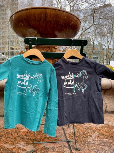 Kids long-sleeved t-shirts by Teres Kids for Bryant Park, featuring the park's carousel and a horse escaping.