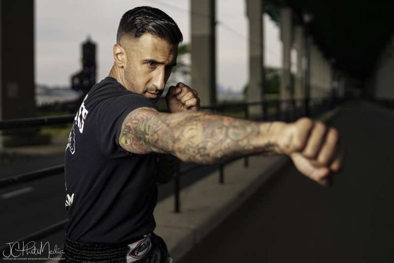 Man posed throwing a jab with right arm