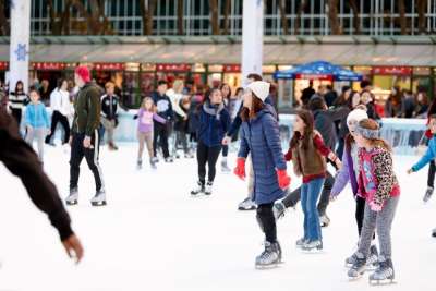 Visitors skate at The Rink at Bryant Park's Winter Village in New York City.