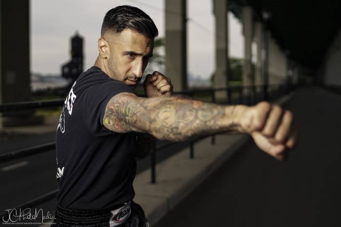 Man posed throwing a jab with right arm